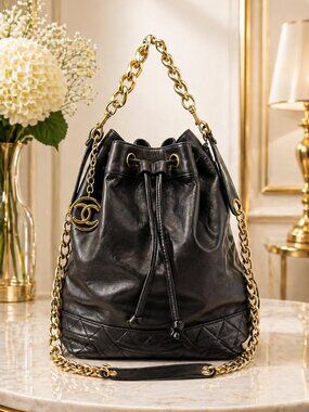 Authentic Chanel Drawstring Bucket Bag Black Leather Gold Chain CC Logo